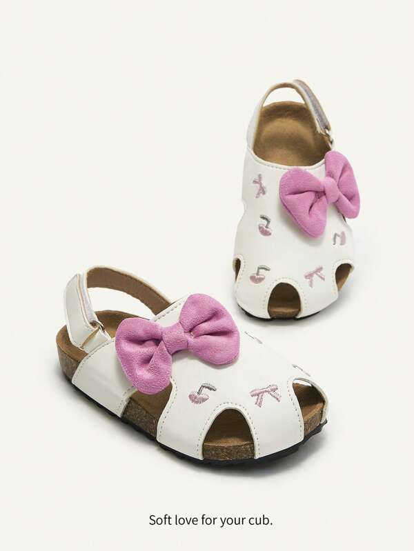 Cozy Pixies Sandalias planas de princesa con lazo rosa, versátiles y lindas, adecuadas para uso casual, vacaciones, bebés y niños pequeños