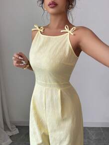 Elenzga Elegante mono de pierna ancha con decoración de lazo en los hombros y estampado floral de margaritas en tela de brocado, adecuado para el uso diario