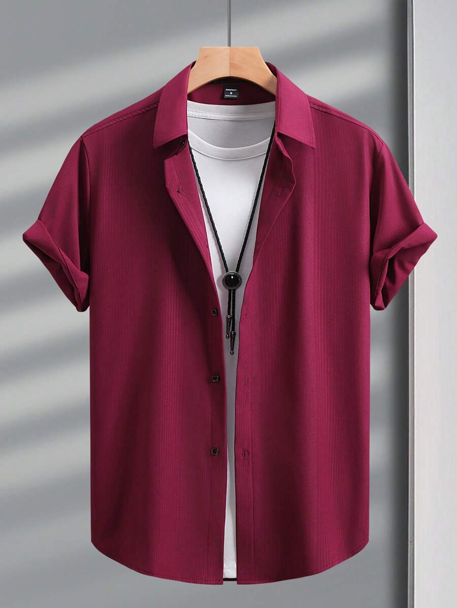 Manfinity Mode Camisa casual de manga corta de un solo pecho de unicolor para hombres, ideal para el verano