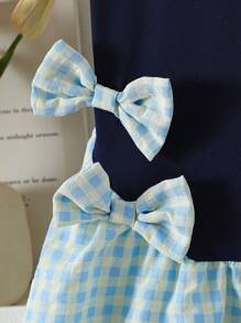 Jong meisje marineblauwe gebreide patchwork geruite jurk met schattige strikdecoratie, frisse stijl casual vakantie mode jurk voor meisjes