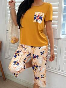 Conjunto de pijama con top de manga corta con bolsillo y pantalones con estampado floral para mujer