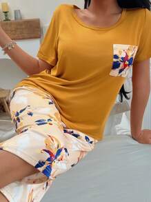 Conjunto de pijama con top de manga corta con bolsillo y pantalones con estampado floral para mujer