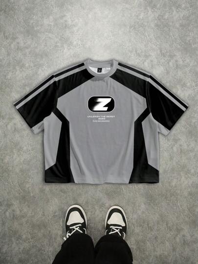 Manfinity EMRG Camiseta suelta y corta con estampado gráfico de colores en contraste negro y gris, de estilo de moda callejera