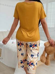Conjunto de pijama con top de manga corta con bolsillo y pantalones con estampado floral para mujer