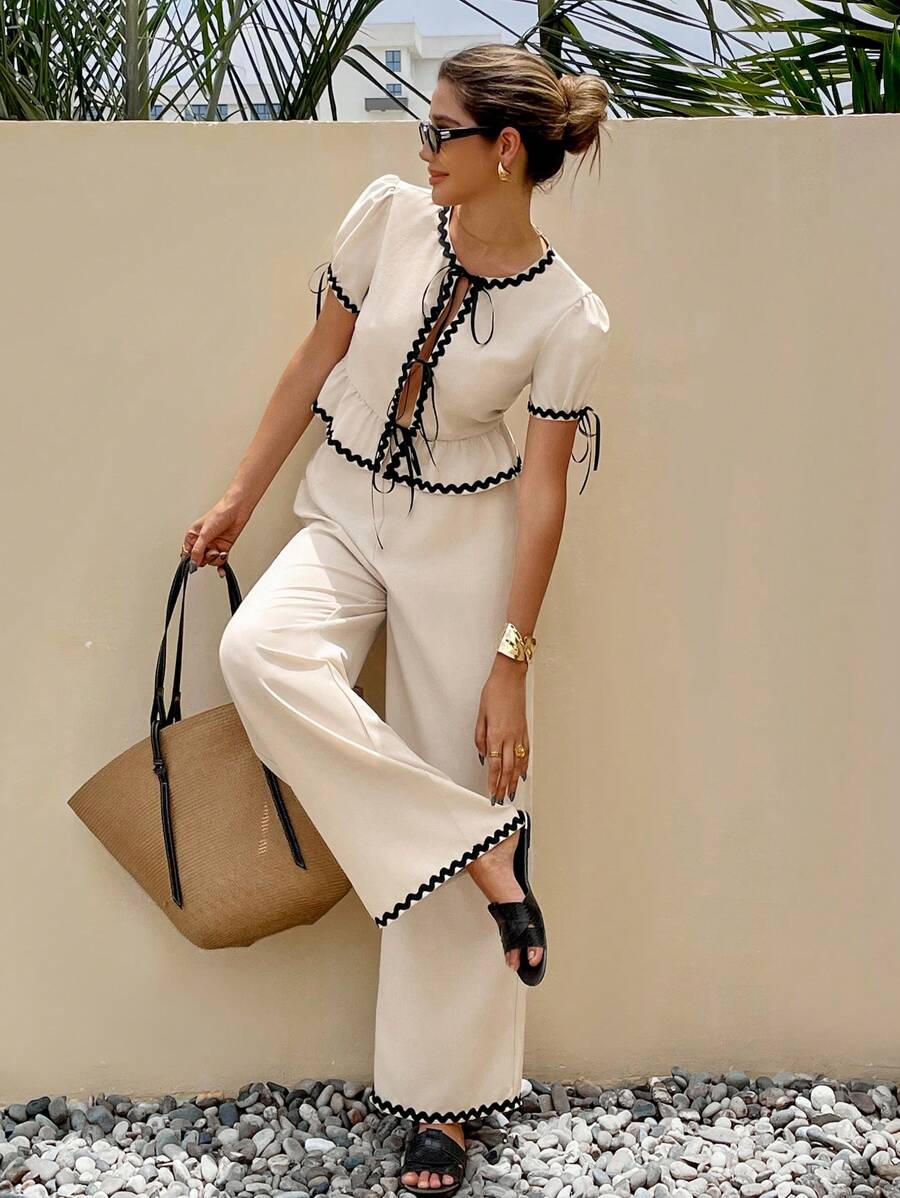 SHEIN Frenchy 2pcs Women Fashion Casual Long Pants & Contrasting Edges The Lotus Leaf Puff Sleeves Top Set,Colorblocked Trimmed Front Center Tie Short Sleeve Top And Pants Set,Waist-Slimming Ruffled Hem Design,Fashion And Romantic Commuting,Contrast Edge, Linen-Like Bamboo Pattern Stretch Fabrics,For Daily Wear Summer - Apricot - View 1
