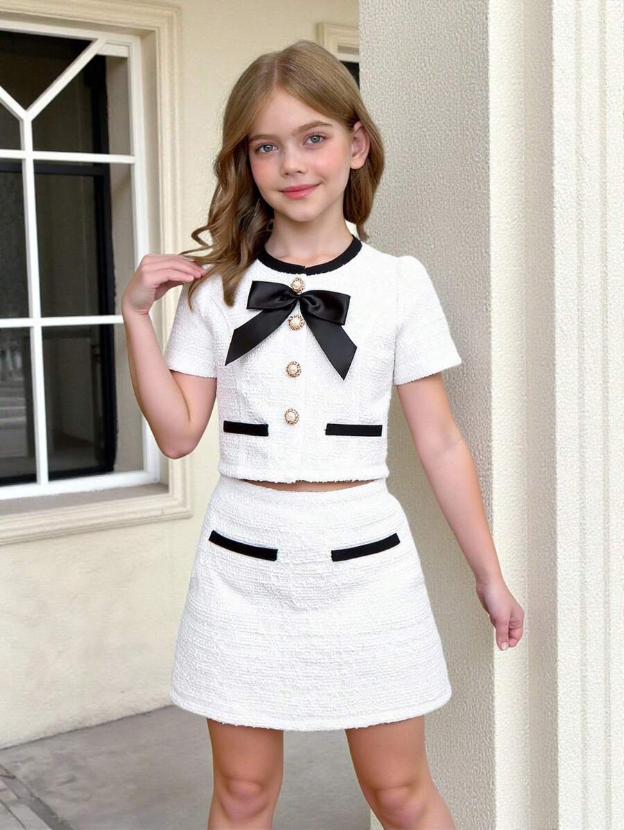 SHEIN Serisse Kids Conjunto elegante de 2 piezas para niña preadolescente, con blusa de tela de tweed con decoración de lazos y botones de perlas imitadas, y falda corte A, estilo dama elegante francés, para volver al colegio