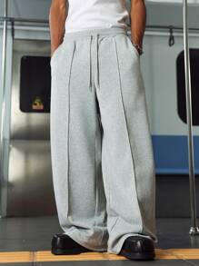 Manfinity Hypemode Men's Casual Style Minimalist Sports INS High Street Light Gray Oversized Long Sweatpants. Featuring A Loose Fit And Elastic Waistband, These Pants Embody Fashionable Styling. They Are Suitable For Music Festivals And Everyday, Making Them An Excellent Gift For Boyfriends Or Husbands. Men's Elastic Waist Drawstring Casual Loose Sweatpants With Pockets, Loose Pants For Men - Light Grey - View 1