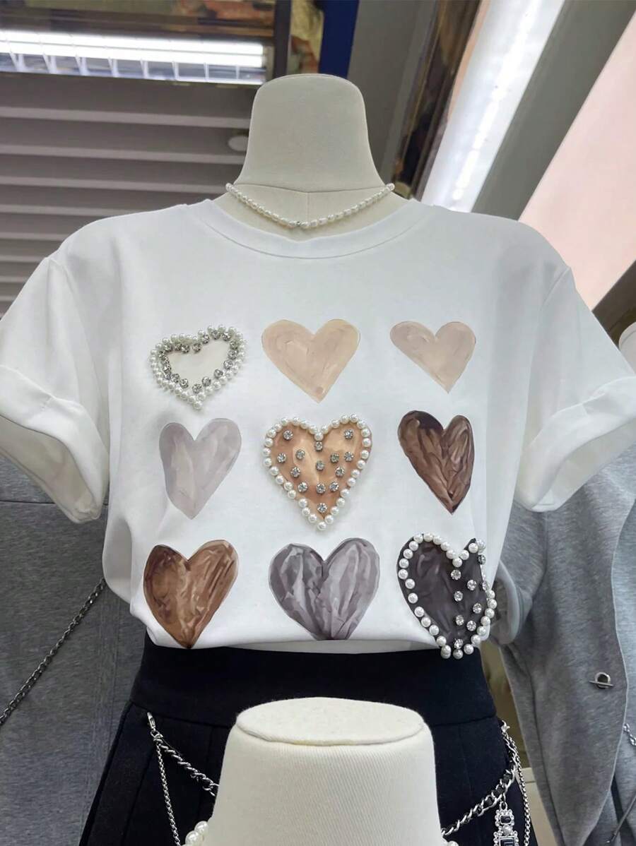 INAWLY Modisches, vielseitiges, locker geschnittenes T-Shirt mit Herz-Nietendekor und Strass-Verzierung am Rundhalsausschnitt, Y2K-Stil Kurzarmshirt - Weiss - Übersicht 1