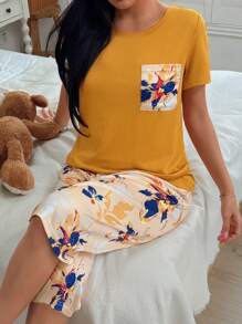 Conjunto de pijama con top de manga corta con bolsillo y pantalones con estampado floral para mujer