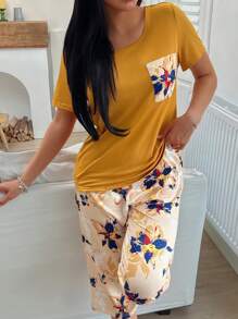 Conjunto de pijama con top de manga corta con bolsillo y pantalones con estampado floral para mujer
