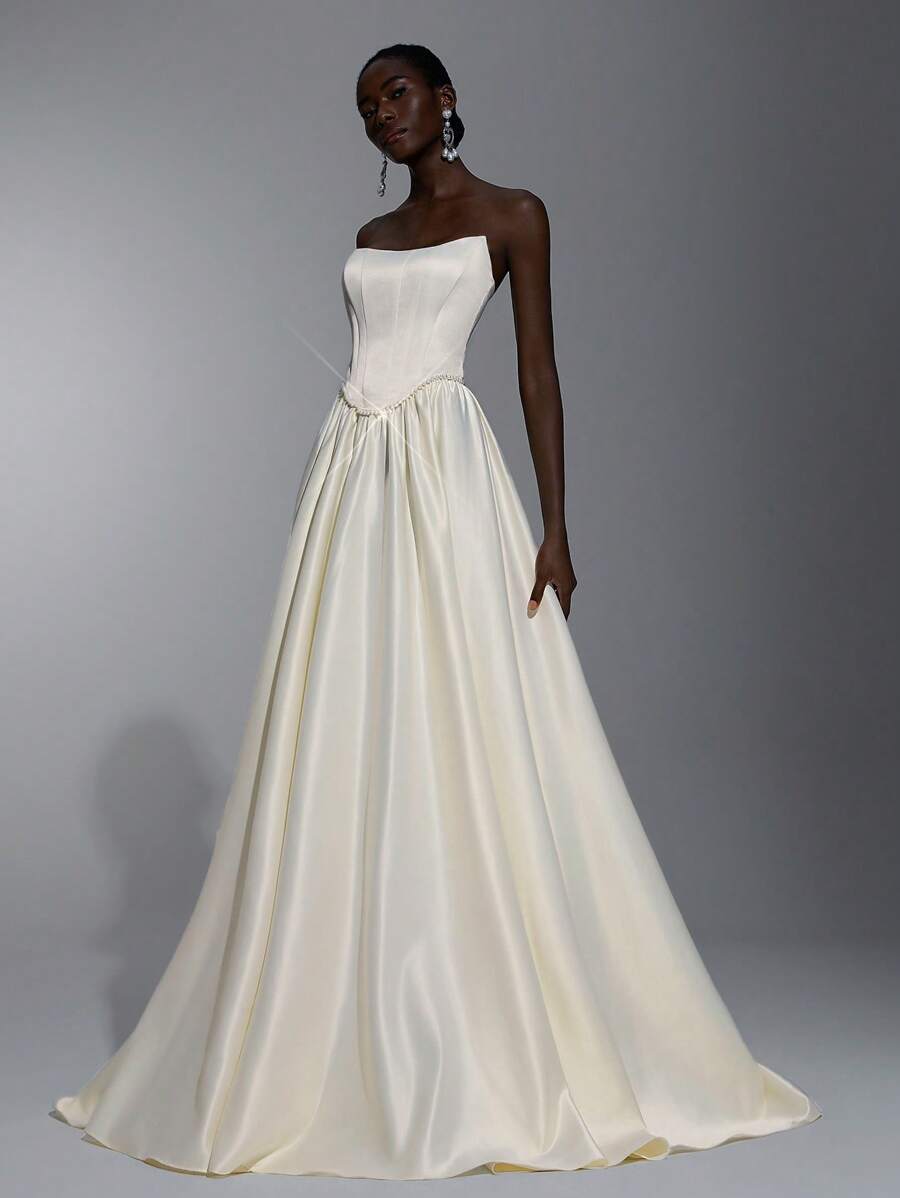 Elitara Elegante vestido sin mangas de satén color beige con escote de halter, cintura baja minimalista con abertura, cintura al estilo "basque", decoración de perlas y silueta evasé súper amplia. Con lazo ajustable en la espalda, adecuado para citas, vacaciones, cumpleaños, graduación, fiestas, bodas, galas formales, veladas, invitada de boda - Albaricoque - Ver 1