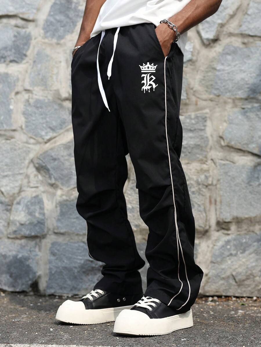 Manfinity EMRG 男士拼色条纹字母印花口袋抽绳腰裤 男士街头潮流裤 街头潮流男士裤子 - 黑色 - 查看 1