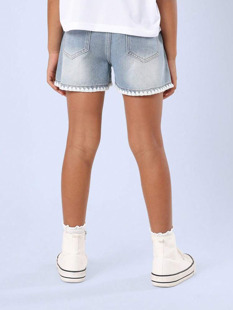 Pantaloncini in denim con finiture decorative a vita media