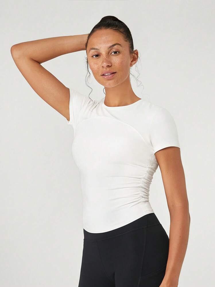 GLOWMODE Camiseta de manga corta con pliegues y cordón FeatherFit™ Focus, soporte ligero, yoga de bajo impacto, estudio y gimnasio - Blanco - Añade 1