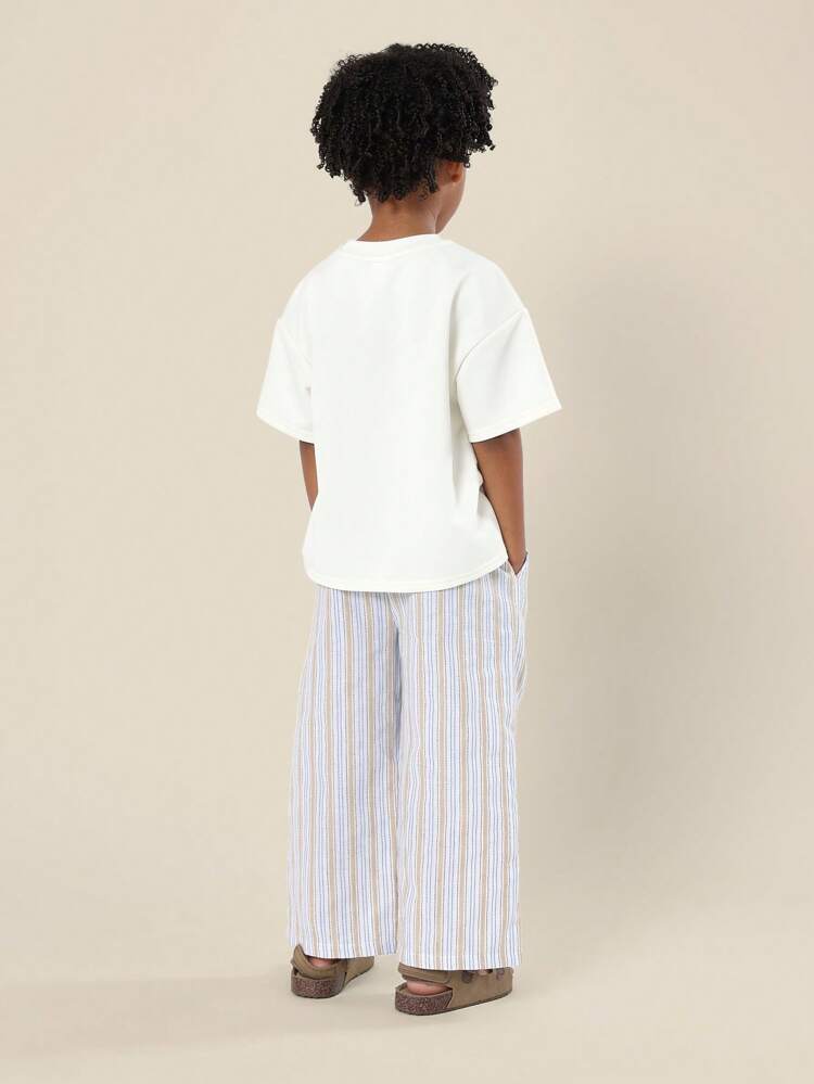 Completo t-shirt oversize a maniche corte e gamba larga