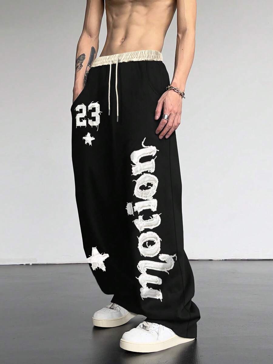 Manfinity Roghcode Men's Loose Fit Cross Printed Drawstring Waist Sweatpants, Sports Academy INS Gray Micro-Flare Sweatpants, Featuring New York Letters And A Lucky Number23 Embroidery. These Sweatpants Blend Style And Comfort, Making Them Perfect For Casual Outings And Athletic Activities, Fall And Winter Jersey, For Rave - Black - View 1