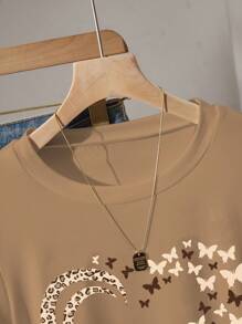 INAWLY Camiseta gráfica con estampado de mariposa y corazón con cintura ceñida, nuevos lanzamientos de verano para mujer - Caqui - Ver 6