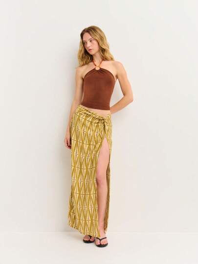 Nöista Bold Printed Wrap Yellow Skirt With Thigh-High Slit. Lightweight Fabric Perfect For Beach Days, São João Vibes, And Holiday.