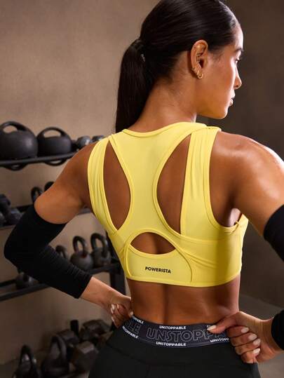 Powerista Sujetador deportivo de uso diario con estampado de letras y espalda abierta para mujeres