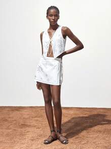 Maija Falda blanca de verano para mujer, cintura elástica con cremallera en la espalda, decoración metálica simple, falda envolvente casual diaria y de fiesta, minifalda, falda pantalón para mujer, falda de verano para atuendos de mujer para club, atuendos sexys de rave, atuendos de festival, atuendos de Halloween, ropa de Navidad, ropa de Halloween para mujer - Blanco - Ver 8