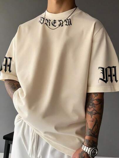 Manfinity EMRG Camiseta casual de manga corta de cuello redondo con estampado de letras de hombro caído para hombre, verano