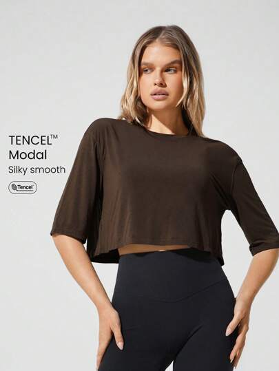 GLOWMODE Parte superior corta activa de cuello redondo sobresalizada, ligera y suave de seda, de TENCEL™ Modal, para llevar en el yoga, pilates, gimnasio y uso cotidiano