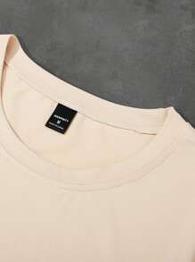 Manfinity EMRG Camiseta casual de manga corta de cuello redondo con estampado de letras de hombro caído para hombre, verano
