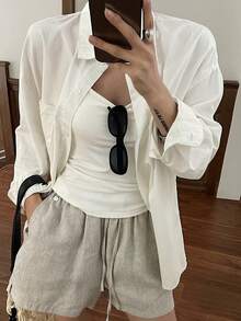 DAZY Blusa de manga larga de unicolor con un botón delantero y bolsillo para mujer