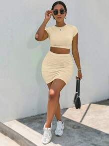 Zolique Conjunto de 2 piezas de top de manga corta y cuello redondo, y mini falda lisos para mujer