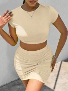 Zolique Conjunto de 2 piezas de top de manga corta y cuello redondo, y mini falda lisos para mujer