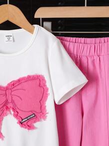 SHEIN Conjunto de 2 piezas para niñas: Camiseta de manga corta de unicolor y pantalones vaqueros estampados con mariposas y decoración de moño 3D, lindo y casual para verano, al aire libre y vacaciones para adolescentes