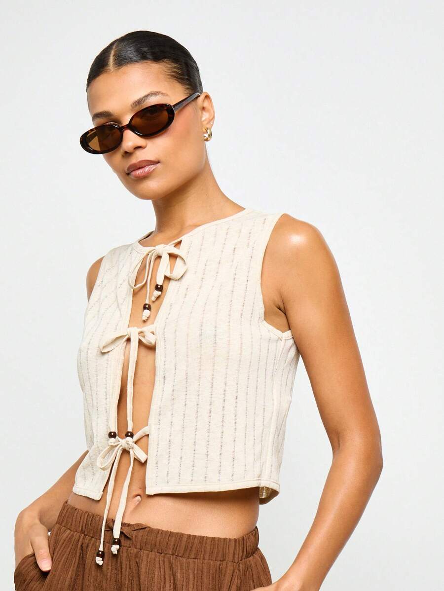 AiiRZ Top corto a costine senza maniche con bottoni in perla, dettaglio con fiocco, stile boho moderno, chic da spiaggia, vacanza estiva, festival - Albicocca - Visualizzare 1