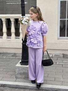 SHEIN Completo da ragazza tween in 2 pezzi: blusa con collo alto, maniche a palloncino e decorazione floreale 3D, pantaloni a vita alta e gamba ampia - Viola - Visualizzare 12