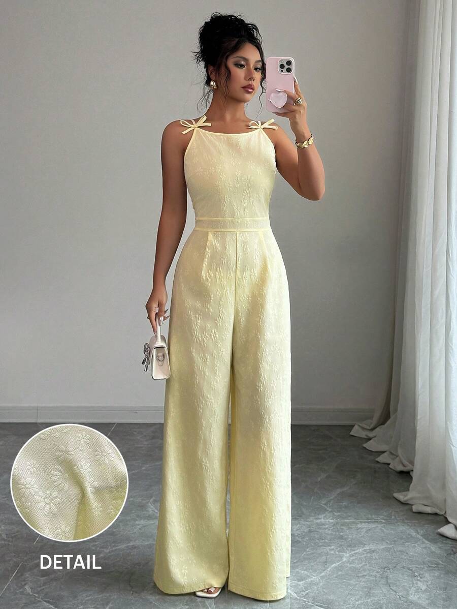 Elenzga Elegante mono de pierna ancha con decoración de lazo en los hombros y estampado floral de margaritas en tela de brocado, adecuado para el uso diario