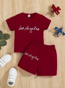 Conjunto de 2 piezas para bebé niño con camiseta de manga corta con estampado de lema y pantalón corto, estilo de moda streetwear