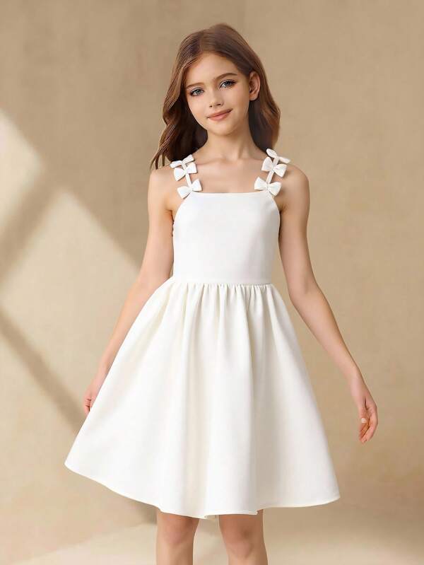 SHEIN Girls' Elegant Fashion Simple Sweet Sleeveless High-Waist Short White Dress With Bow Design