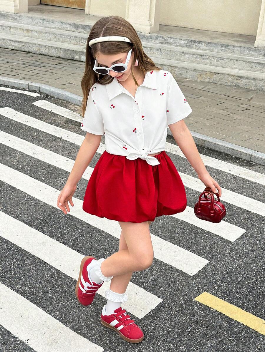 SHEIN Tween Girl Short Sleeve Shirt In Summer Is A Must-Have. The Cherry Pattern On The Shirt Looks Vivid, As If Dotting Sweet Fruits. It Is The Perfect Choice To Create An Adorable Look For Your Little One. - White - View 1