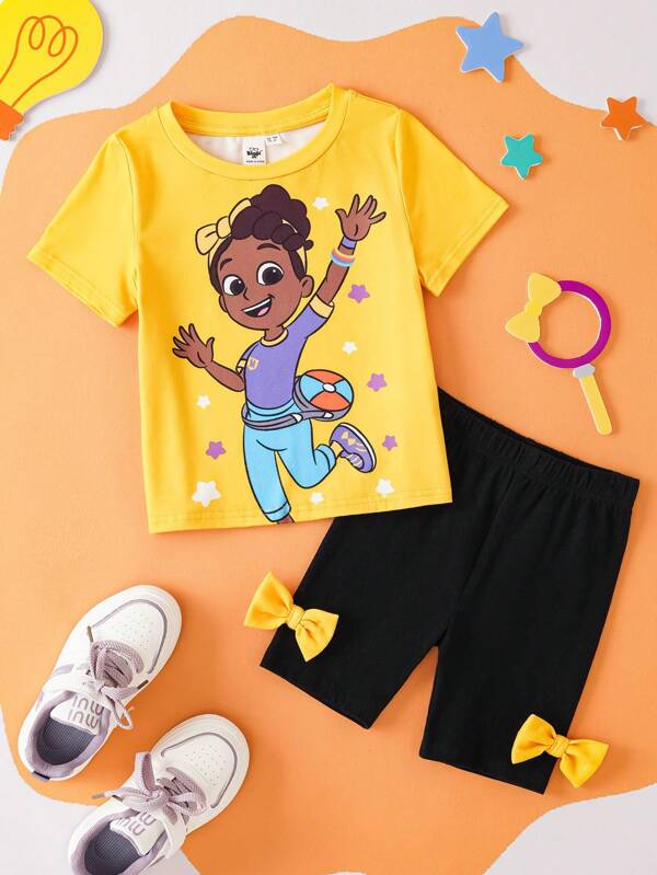 Blippi X SHEIN Conjunto de 2 piezas de camiseta gráfica amarilla con patrón de estrella de dibujos animados y shorts negros ajustados con decoración de lazo para niña