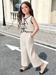 SHEIN Conjunto de 2 piezas de top sin mangas y falda entallada de línea A de punto liso para niñas jóvenes