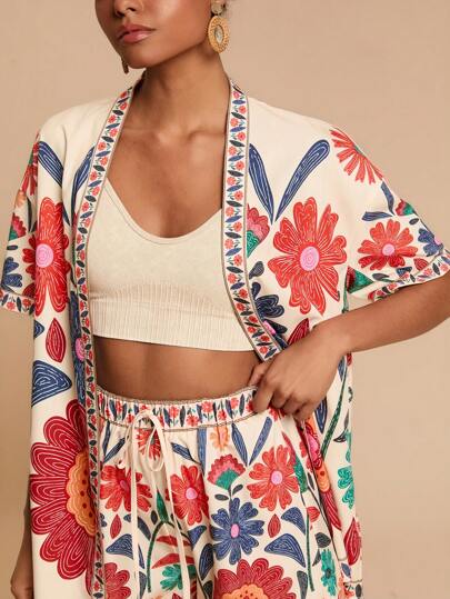 Travachic Conjunto de 2 peças de camisa feminina de manga curta e shorts soltos de cintura alta para férias, estilo férias, estampa gráfica, roupas casuais de férias de verão para mulheres, roupas de férias de praia boêmias, boho chique, roupas de festivais de férias, roupas de praia para mulheres, roupas de verão para mulheres, roupas de formatura, roupas de aniversário para mulheres, itens essenciais de praia, adequados para encontros de férias, chá da tarde, temporada de casamentos, férias em cruzeiros na praia, férias em viagens de carro pela cidade, férias boho, festivais de música, roupas elegantes para mulheres