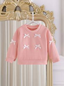 SHEIN Effen sweatshirt met ronde hals en strik voor babymeisjes. Het ronde halsontwerp is klassiek en elegant, waardoor het gemakkelijk aan en uit te trekken is. De lange mouwen en de decoratieve 3D-strik op het lijfje combineren vakkundig de schattige en modieuze elementen, waardoor de levendigheid en speelsheid van het meisje worden benadrukt. Het getailleerde silhouet en de vloeiende lijnen flatteren het figuur van de baby en stralen zelfvertrouwen en geluk uit. Dit sweatshirt is geschikt voor diverse gelegenheden.