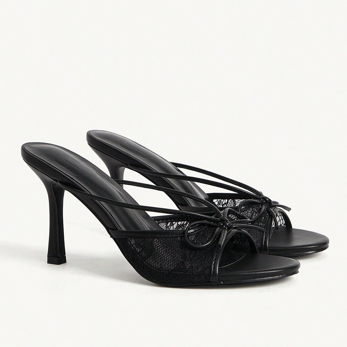 Sandalias de mujer con parches de malla PU negra, tira con moño, punta redonda y tacón de aguja alto. Elegantes y románticas, adecuadas para el té