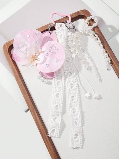 Kawaii 1 pieza Orquídea artificial color rosa pálido minimalista y versátil de estilo Ins, decoración con strass, moño hecho a mano con perlas blancas falsas, correa trenzada con estrella, alfombrilla DIY para teléfono, llavero y accesorio para bolso, adecuado para mujer, uso diario, regalo para fiestas