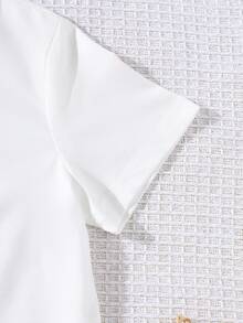 GraphicGems Young Boy Wink Smiling Face Print Casual Round Neck Short Sleeve T-Shirt, Summer