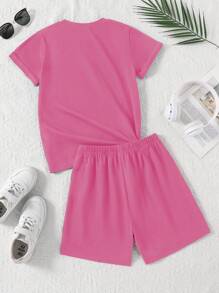SHEIN Explorewe 2 件/套女孩服装，大女孩情人节休闲舒适简约卡通蝴蝶结和英文图形印花短袖 T 恤 + 黑色运动短裤，适合春夏日常穿着 - 粉色 - 查看 2