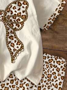 SHEIN Bộ 2 món/bộ trang trí nơ họa tiết da báo Mỹ phong cách cổ điển thường ngày cho bé gái, bộ áo tay ngắn và quần đùi, phù hợp với mùa hè, thời trang thập niên 80, màu Mocha Harmony, thể thao, sẵn sàng cho lễ tốt nghiệp, trẻ em vui vẻ - Nhiều màu - Xem 5