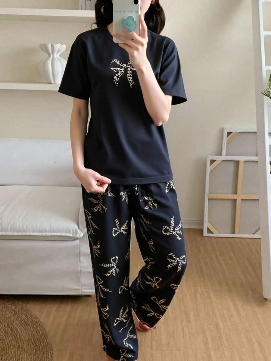 青少年女孩睡衣套装 - 黑色纯色圆领短袖上衣,豹纹和蝴蝶结图案,搭配全身豹纹蝴蝶结图案针织裤,舒适时尚的夏季睡衣两件套 - 黑色 - 查看 1