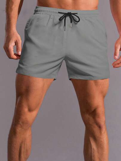 Manfinity Homme 男士纯色抽绳腰短裤，适合夏季男士短裤，男士抽绳腰短裤，男士灰色短裤，男士健身短裤，男士健身短裤，男士运动短裤，经典灰色面料男士短裤，带口袋细节，适合健身和休闲穿着，男士抽绳短裤，灰色泳裤，男士休闲短裤