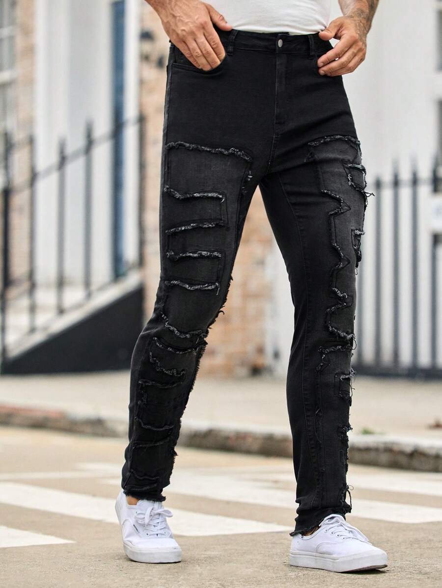 Manfinity VCAY 男士黑色牛仔褲,底部撕裂處呈現毛毛邊效果