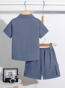 SHEIN 2pcs/Set Young Boy Military Green Half Open Collar Short Sleeve Jacket And Shorts Set, Casual Utility Pockets Suit For Summer Outgoing, Holiday, Sporty Everyday Wear